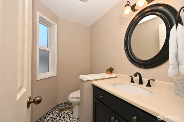 Updated half bath on the main level.