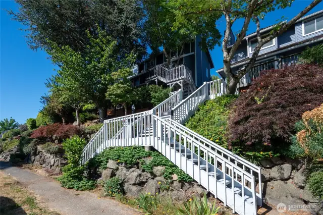 Steps up to the home on the left side. Ample street parking.