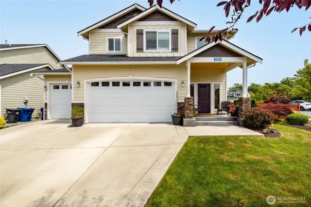 West facing home has large corner, fully fenced yard and 3 car garage