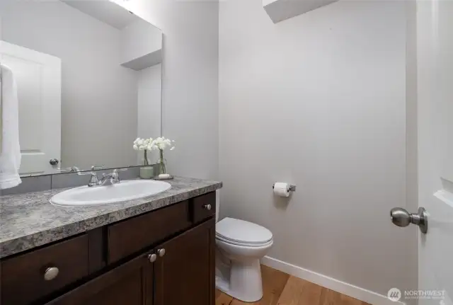 Main level half bath with granite counters