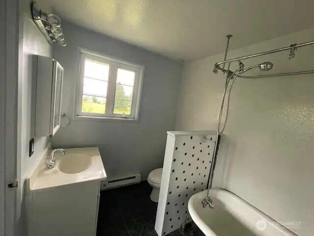 Bath off upper bedroom  with water views