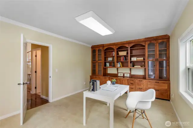 office with built-in alder wood cabinets and shelving
