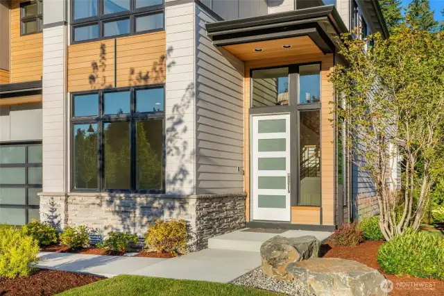 Soaring covered entry with cedar soffit