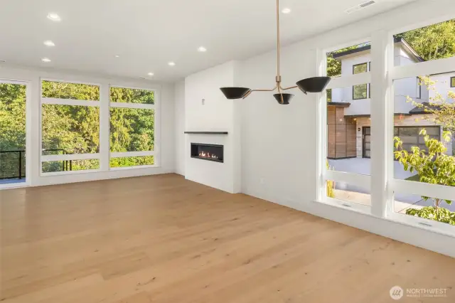 Extensive use of wide plank hardwood flooring throughout the home including main floor, stairs, upper hallways, upper rec room, and Primary
