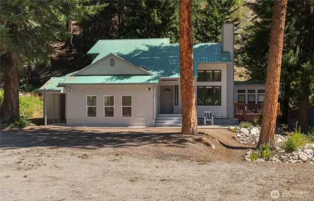 The main home greets you with plenty of parking.