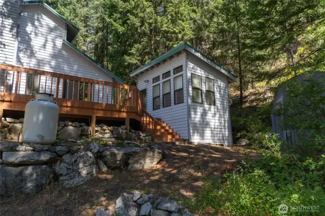 Deck leads to detached heated studio perfect for hobbies, home office, or guests.