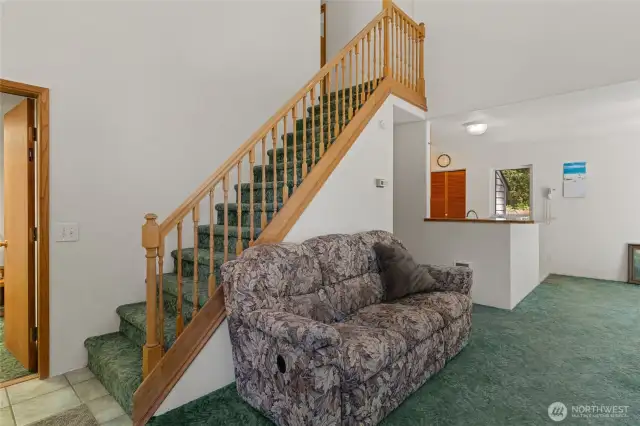 Vaulted Living Room to second story with 2 more bedrooms and another bathroom