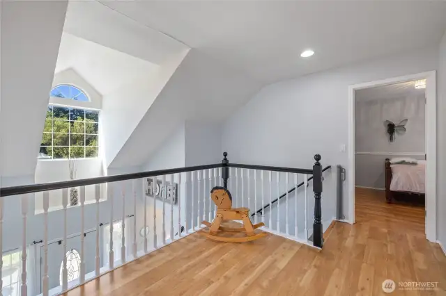 Spacious landing at the top of stairs offers room to breath and maybe even do some yoga!