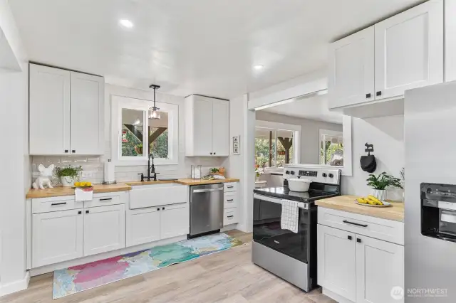 Fully renovated kitchen with lvp flooring throughout home.