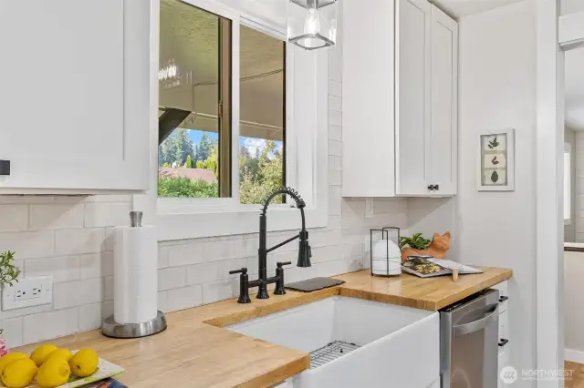 Butcherblock countertops with farm sink.