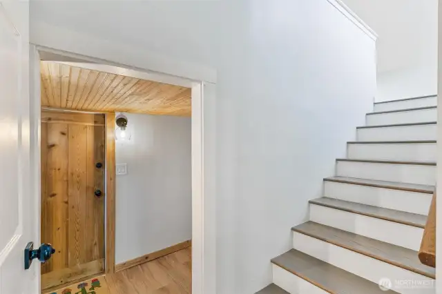 Stairs to primary. Door to pantry and mud room.