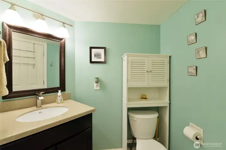 1/2 bath with a shower between the two bathrooms