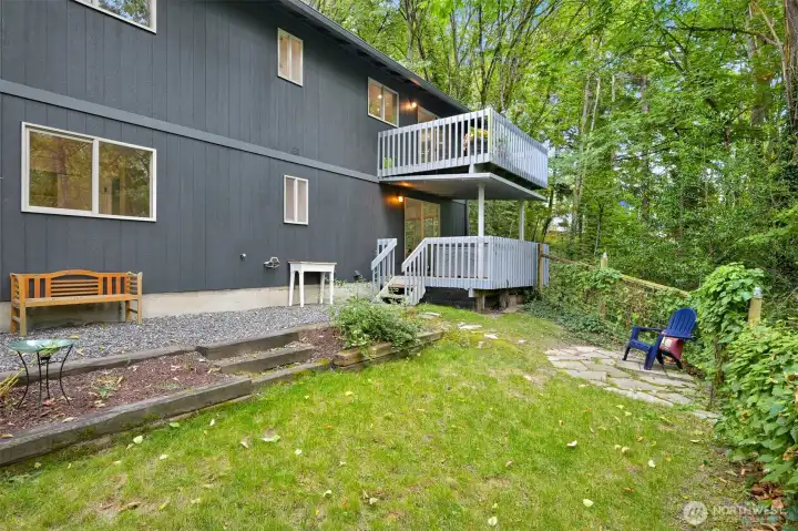 Fully fenced backyard with low maintenance landscaping.