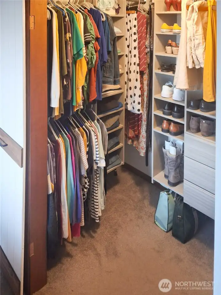 Primary bedroom walk-in closet