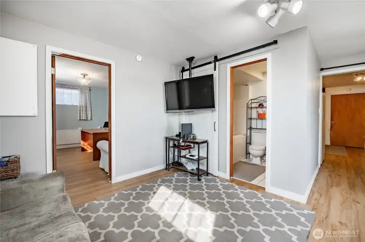 Basement bonus room with full bath, beyond the door is office or future bedroom for MIL.