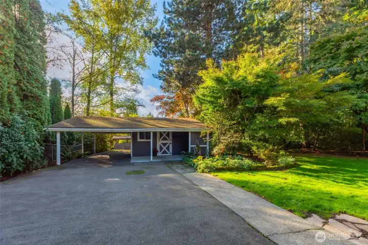 In front of the barn is ample space for an RV, basketball court, play space, bike riding, projects & more. All tucked behind a gate offering privacy from the front yard.
