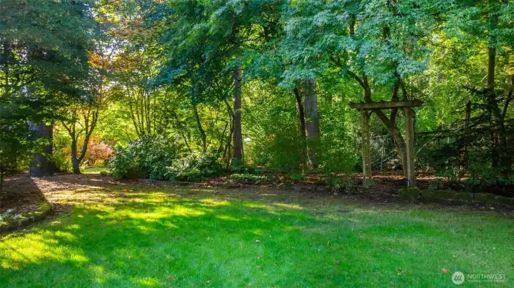 1/2 acre property with lots of different areas for play, gardening, fit pit, even chickens. Landscaped in a way that offers surprises around event turn.