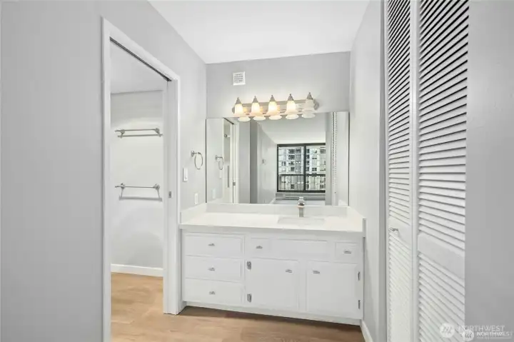 Primary bathroom vanity with bathtub/shower and toilet