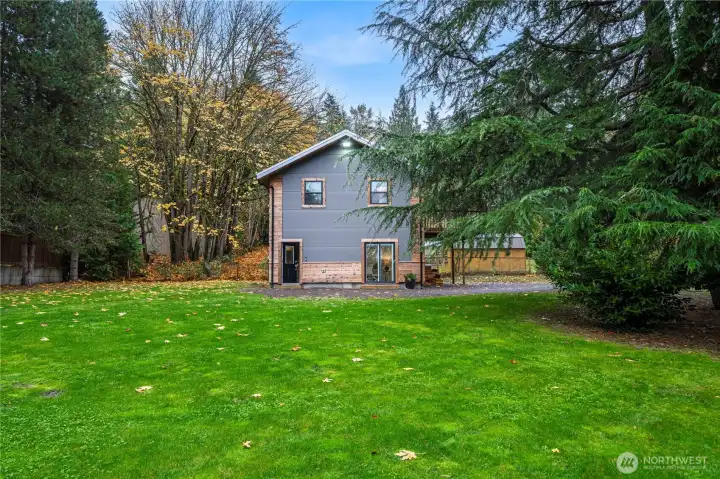 Outside the home, the spacious and level lot is ideal for any gardener: raised beds, a water feature . . . bring your dreams! There’s room for lawn games or just chilling by the firepit with a beverage under the stars at dusk. Loads of parking too —boat, RV, all your toys will have a space