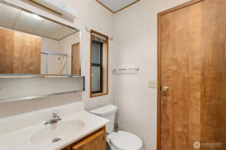 Full Bathroom accessible from Laundry room and secondary bedroom access