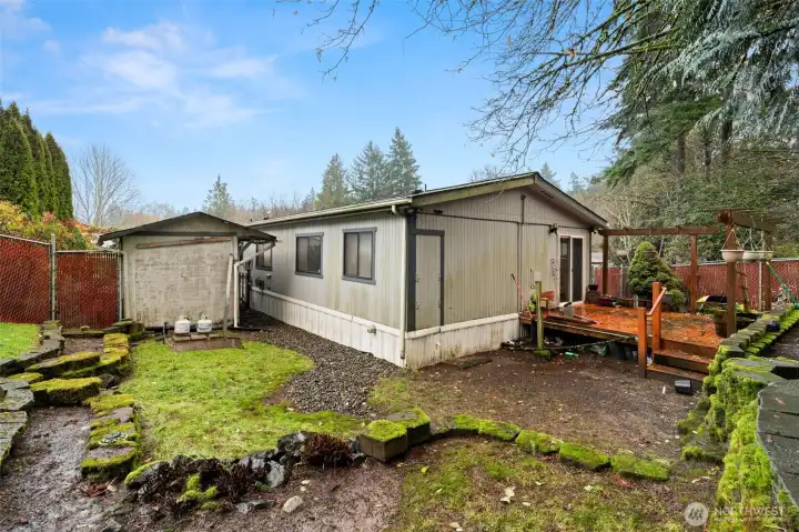 View showing yard and back deck , Fully fenced Backyard
