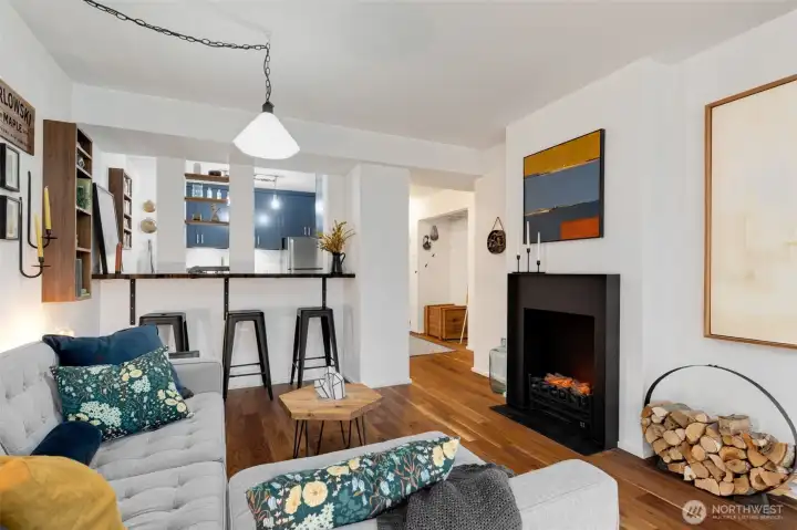 The unit has so many wonderful features including engineered walnut flooring throughout and a custom iron mantle and surround on the electric fireplace.