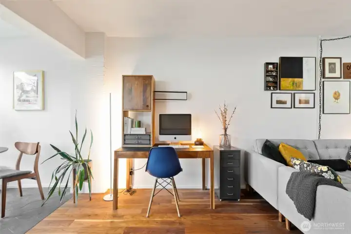 Space for work from home as the floor transitions to the tile/atrium space.