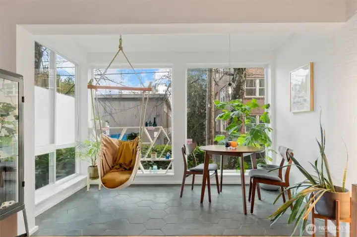 The light-filled space makes an excellent place for plants and to dine, read and relax.