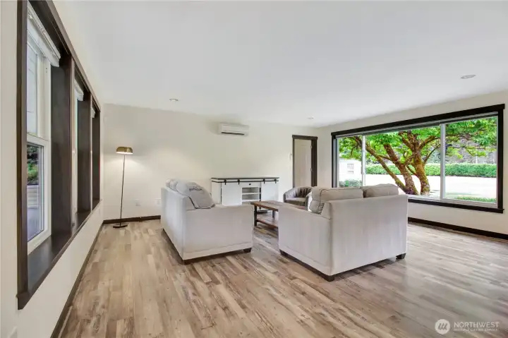 Entry with large bay windows front and back. Staging has been updated and is different now!