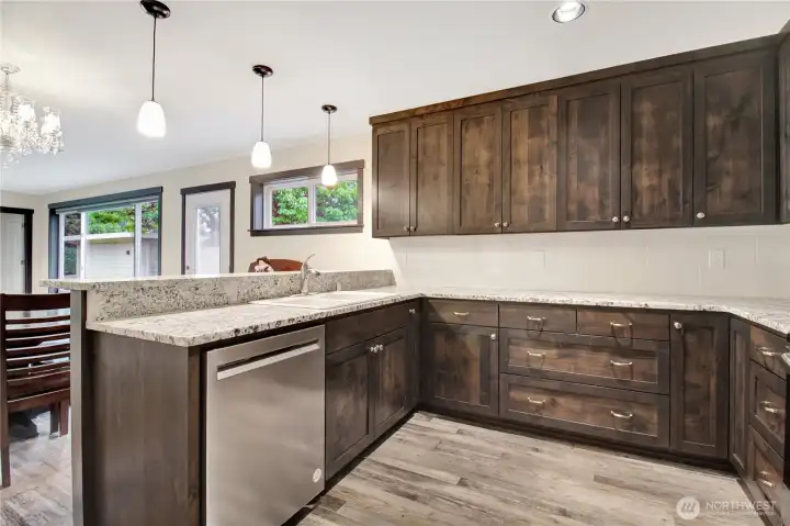 Quartz counter tops with plug ins and ample storage space.