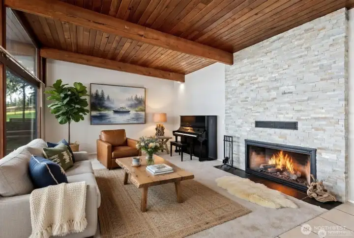 Living room has been virtually staged to show potential layout.