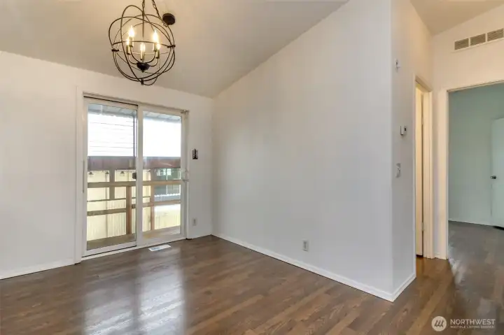 Dining area with slider to back deck.
