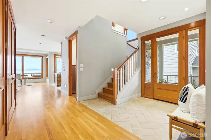 Entry and hall to great room & kitchen. Gorgeous hardwoods and millwork.