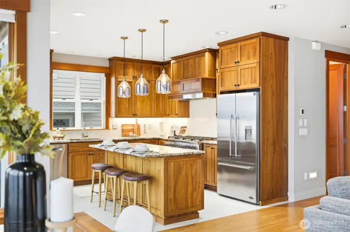 Well chosen surfaces, lighting, appliances; Heated tile floors; practical, comfortable and seamlessly blended into this chef's dream kitchen.