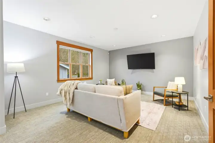 This family room can accommodate large pieces of furniture for maximum seating to entertain.