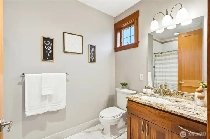 Main floor ensuite full tile bath; granite, gorgeous cabinetry, heated floors. Main floor ensuite full tile bath; granite, gorgeous cabinetry, heated floors.