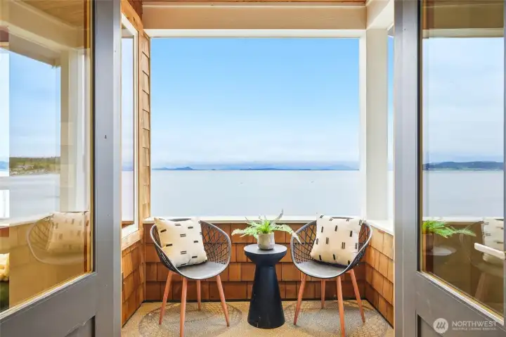 French doors open to a private covered balcony. French doors open to a private covered balcony.