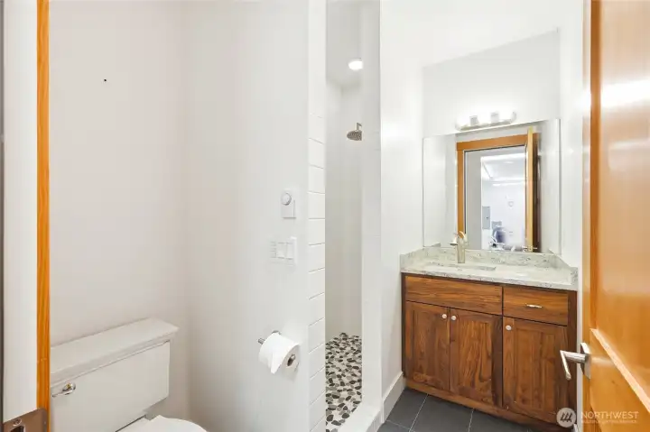 Downstairs 3/4 bath for garage and recreation room. Downstairs 3/4 bath for garage and recreation room.