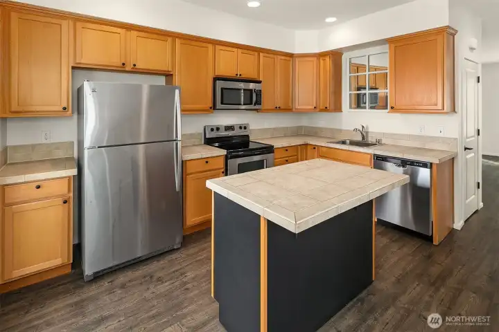 The kitchen flows seamlessly from the living space with the same light and airy feel throughout.