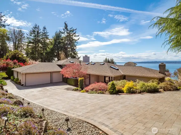 This stunning NW Contemporary home  showcases the Puget Sound and the Olympics from every floor.