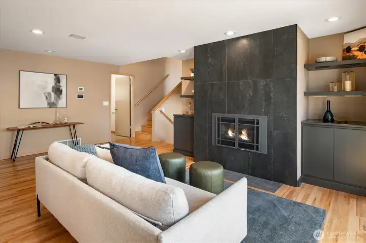 The den has a cozy gas fireplace perfect for lounging.