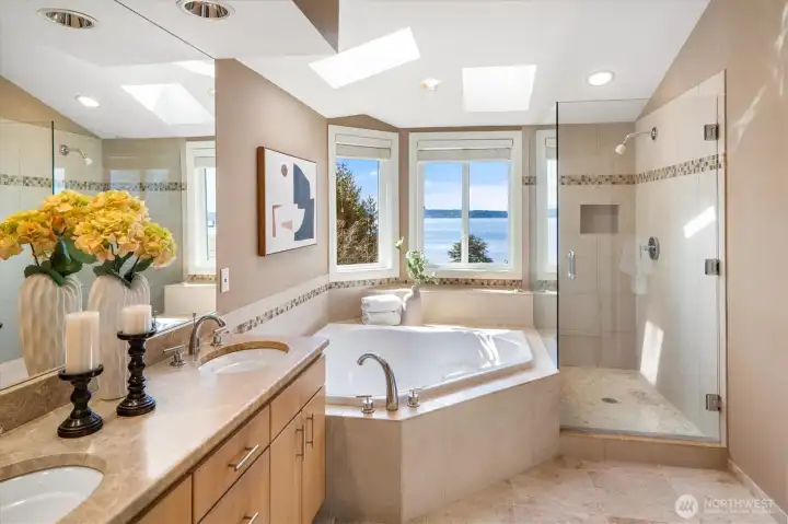Relax in the 5-pcs bath with vaulted ceilings and a skylight.
