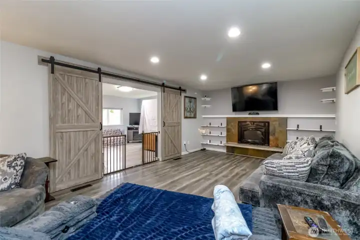 The double wide entry with newer barn doors leads into the living room which is currently used for the gym and home office-there is access to the backyard lawn from this living room The double wide entry with newer barn doors leads into the living room which is currently used for the gym and home office-there is access to the backyard lawn from this living room