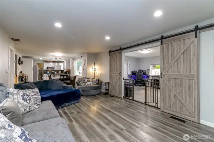 if you were at the wood burning fireplace, this is the view you would see of the great room and the living room which can be closed off with sliding barn doors if you were at the wood burning fireplace, this is the view you would see of the great room and the living room which can be closed off with sliding barn doors