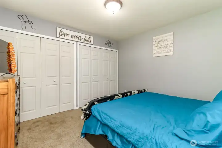 The main floor primary bedroom, remember there are two, has a wall of closet space. The main floor primary bedroom, remember there are two, has a wall of closet space.