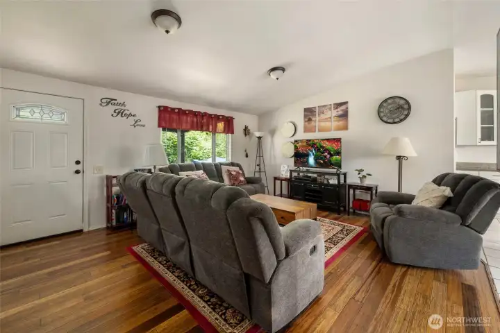 Enter through the front door into the living room. Notice the bamboo floors. Enter through the front door into the living room. Notice the bamboo floors.
