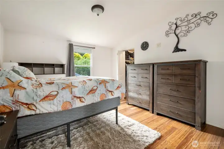 Primary bedroom with door to walk in closet. Primary bedroom with door to walk in closet.