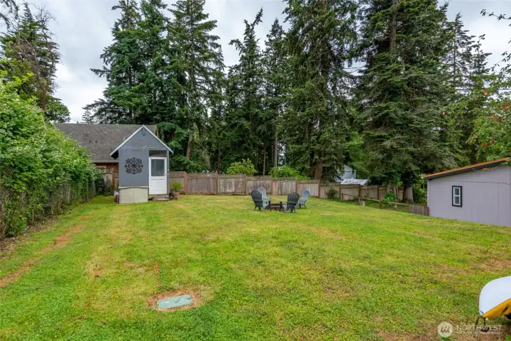 Partially fenced in backyard. Partially fenced in backyard.