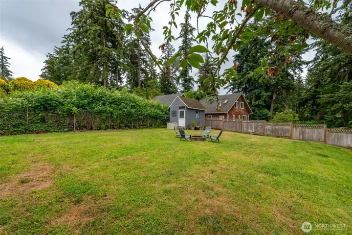 Enjoy a cozy fire in this peaceful backyard. Enjoy a cozy fire in this peaceful backyard.