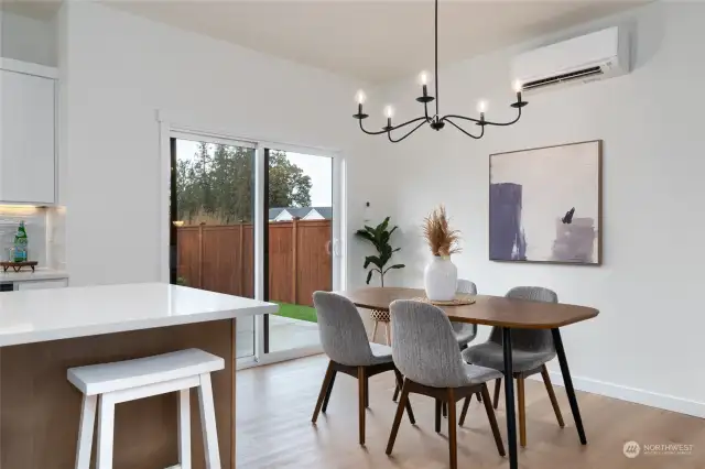 Dining area in primary dwelling with slider to backyard.